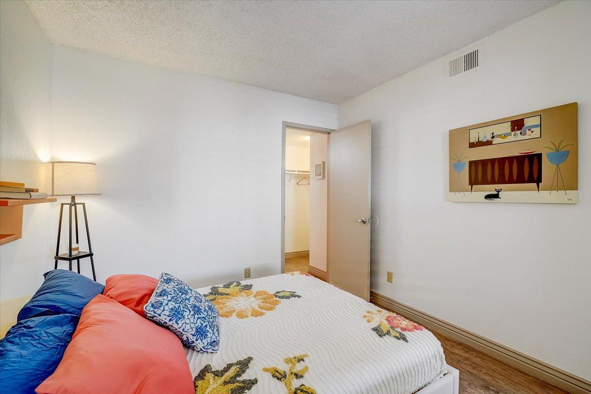 Primary bedroom from the bed, closet and hallway door