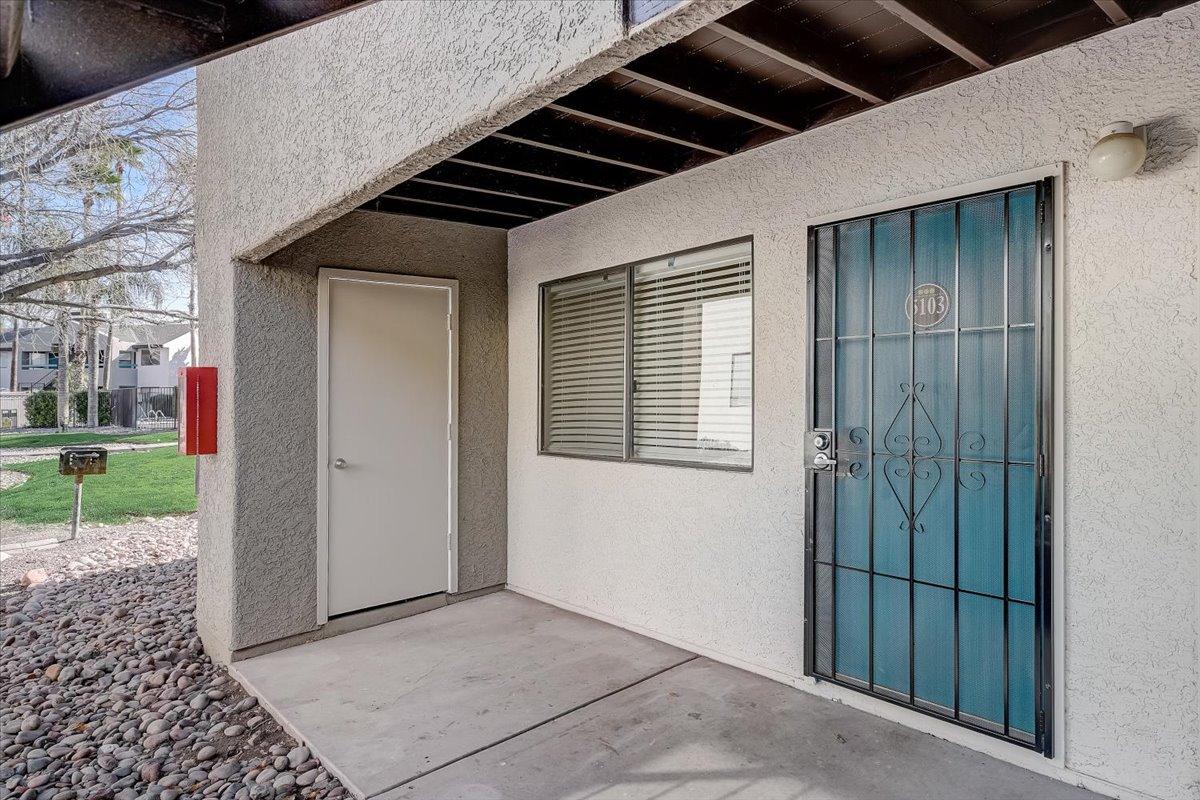 Covered entry and blue security door of a vacant apartment (unit 5103)